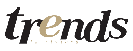 Black and gold "trends" text with "in riviera" in smaller beige text below.