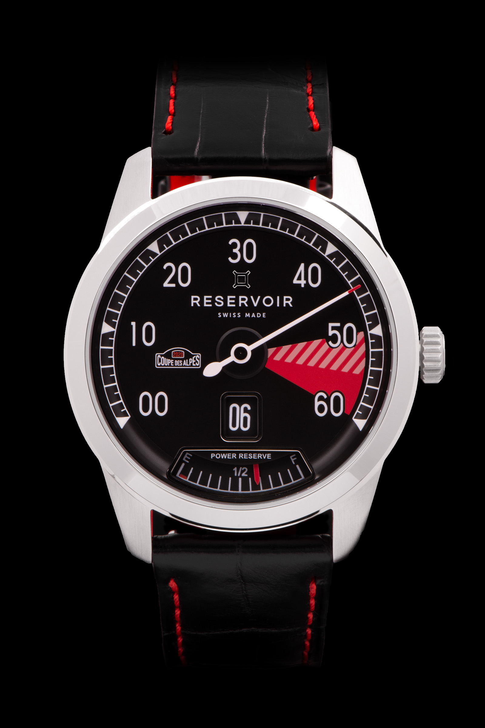 Reservoir wristwatch with retrograde minute display, power reserve indicator, and black leather strap.