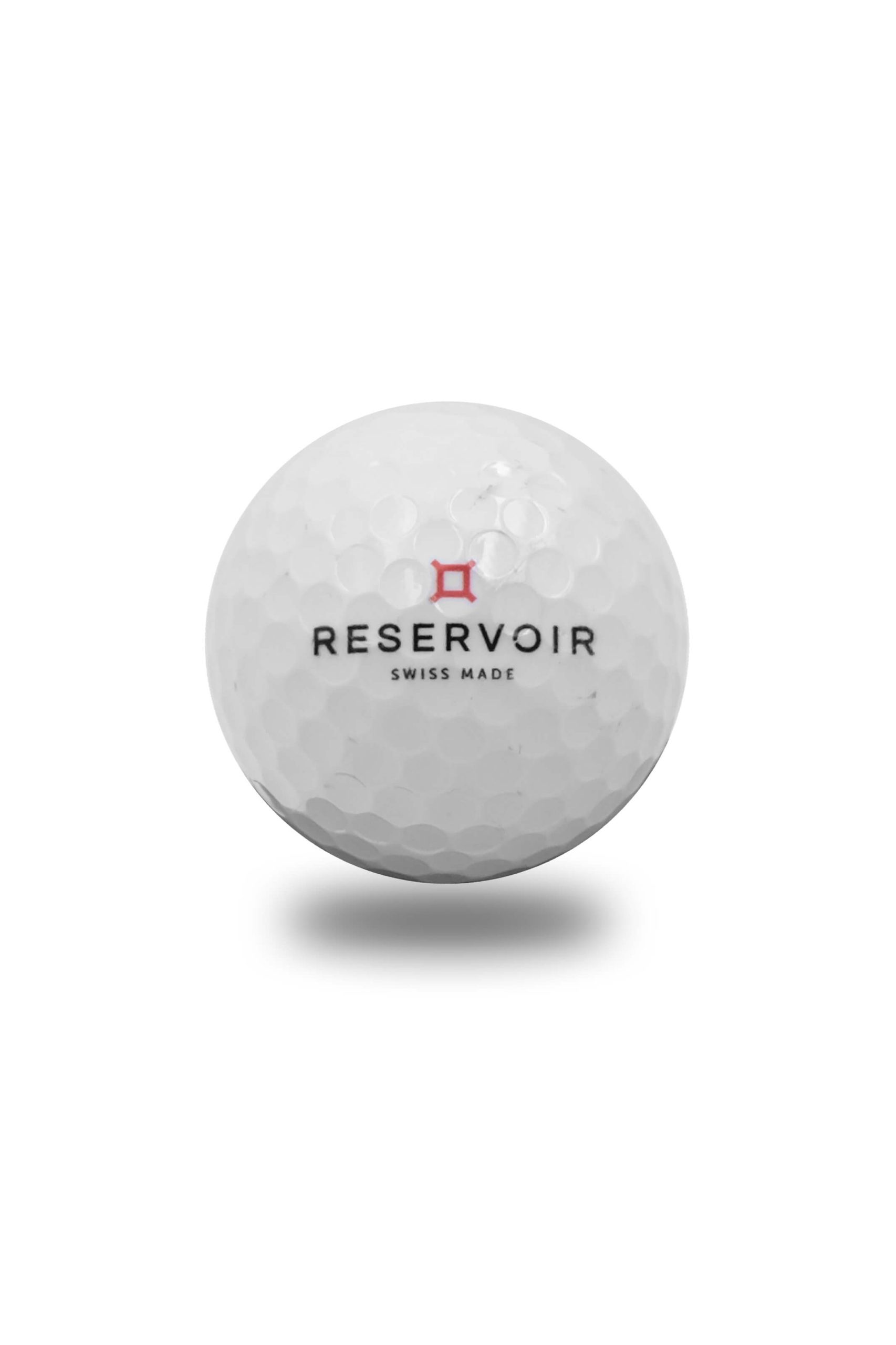 White golf ball with "RESERVOIR," "SWISS MADE," and red logo on a plain background.
