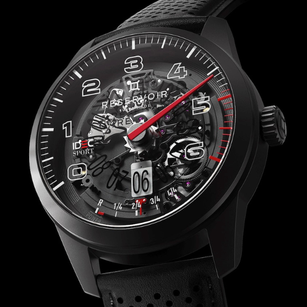 Black wristwatch with transparent dial, visible mechanics, white numerals, red seconds hand, date display.