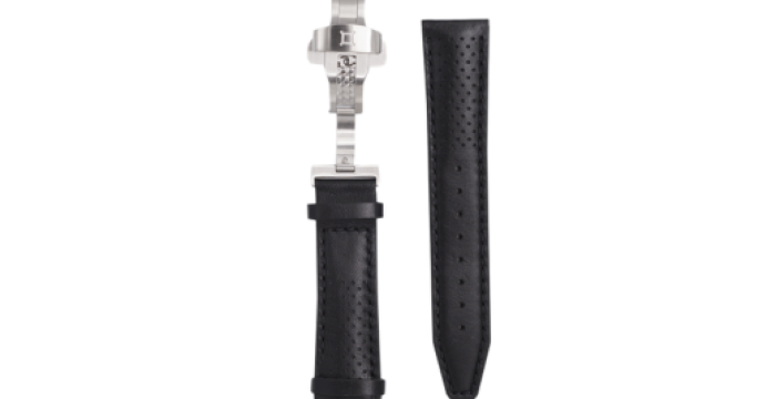 Two black perforated watch straps, one attached to a silver clasp, the other separate.