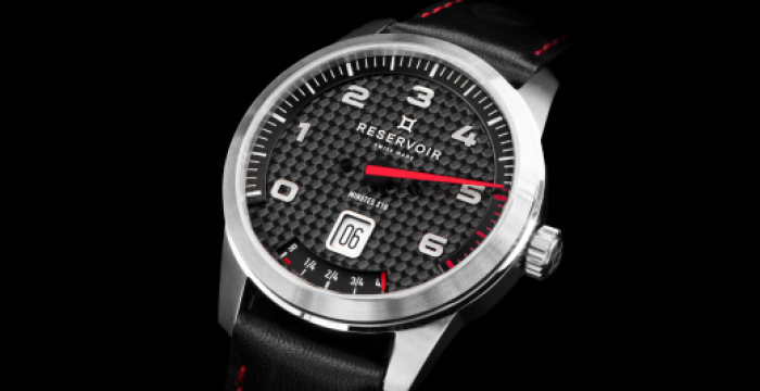 Men's analog wristwatch with carbon fiber dial, stainless steel case, black leather strap, date display.