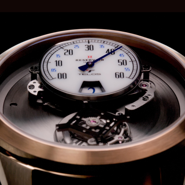 Close-up of a Reservoir Telos mechanical watch face with exposed internal mechanisms.